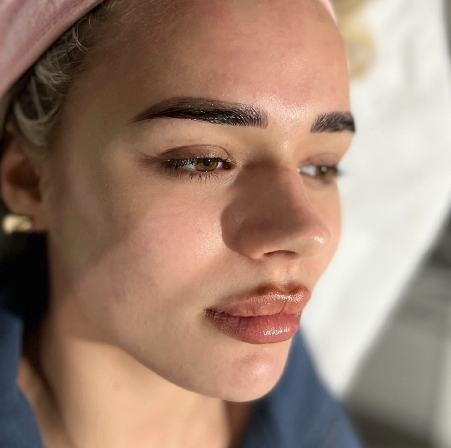Side profile showing radiant and even-looking skin after a facial