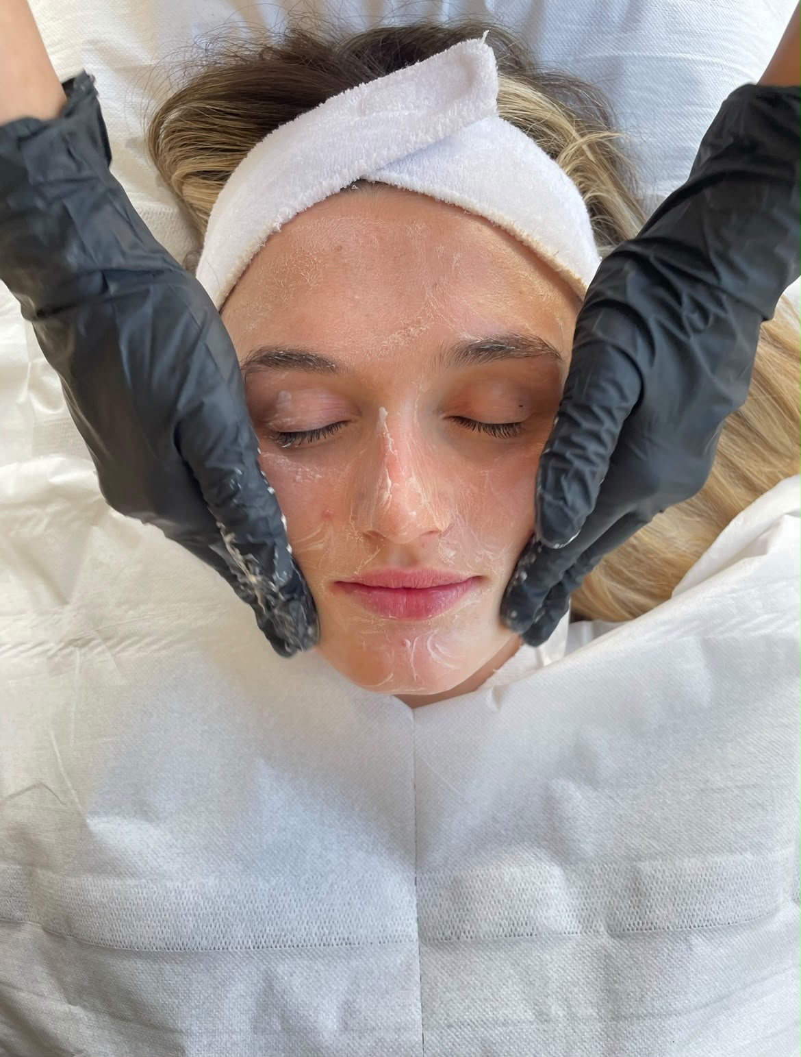 Professional facial massage being performed during a skincare treatment